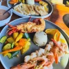 Savor a delectable seafood lunch at Villa Ortegas with grilled fish, shrimp, and fresh vegetables. Discover the perfect blend of flavors in a tropical setting.