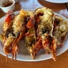 Fried lobster at Restaurant Villa Ortegas, served on a large white plate.