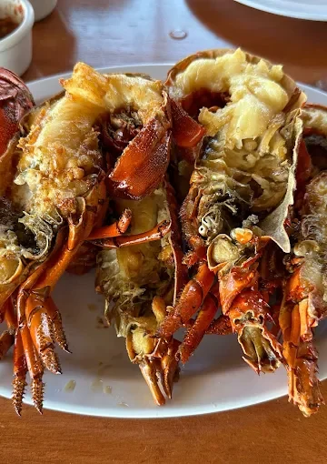 Fried lobster at Restaurant Villa Ortegas, served on a large white plate.